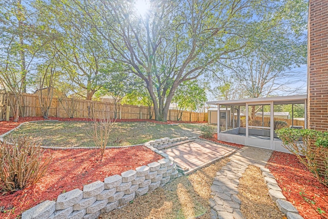 view of yard with a sunroom
