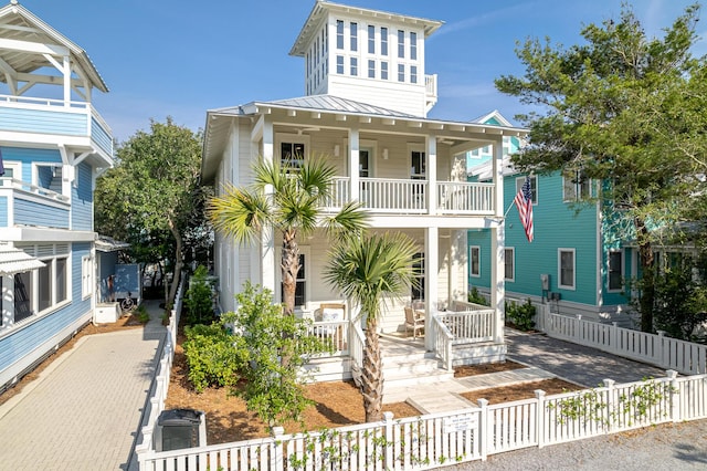 36 E Ruskin St, Santa Rosa Beach, FL 32459 - raised beach house with a balcony and covered porch