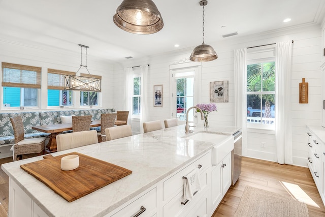 36 E Ruskin St, Santa Rosa Beach, FL 32459 - kitchen with pendant lighting, sink, dishwasher, and a kitchen island with sink