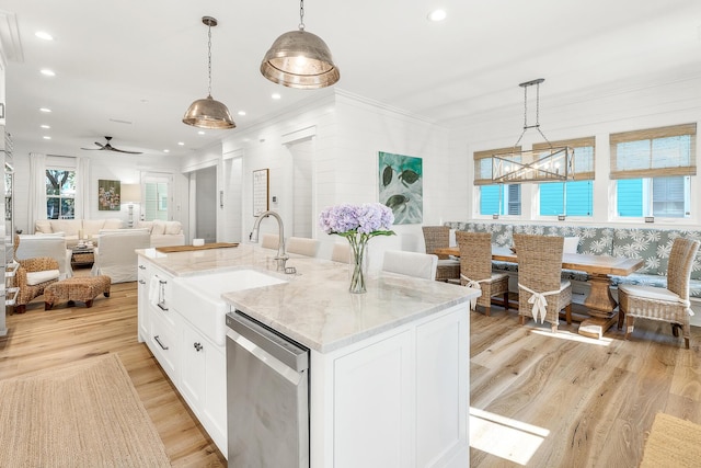 36 E Ruskin St, Santa Rosa Beach, FL 32459 - kitchen with sink, white cabinetry, decorative light fixtures, dishwasher, and a kitchen island with sink