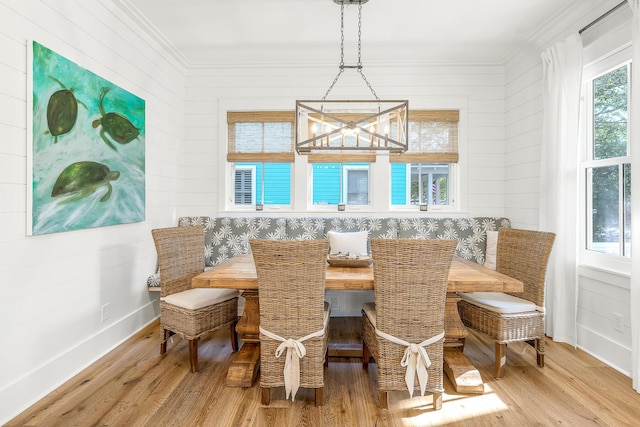 36 E Ruskin St, Santa Rosa Beach, FL 32459 - dining area featuring crown molding, a chandelier, light hardwood / wood-style floors, and breakfast area