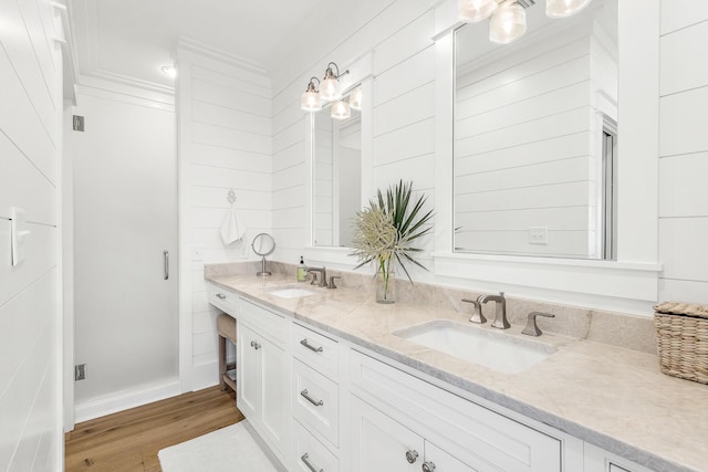 36 E Ruskin St, Santa Rosa Beach, FL 32459 - bathroom featuring vanity, hardwood / wood-style floors, and crown molding