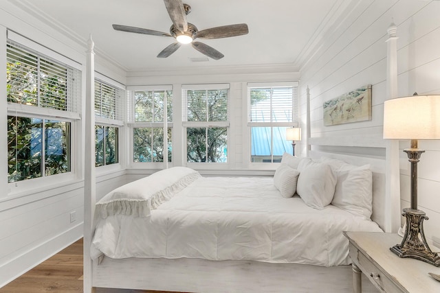 36 E Ruskin St, Santa Rosa Beach, FL 32459 - bedroom with hardwood / wood-style flooring, crown molding, and ceiling fan