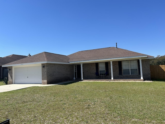 single story home featuring a front lawn, fence, concrete driveway, a garage, and brick siding