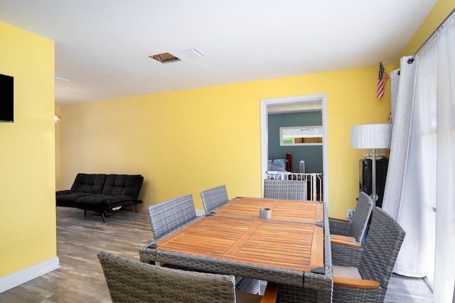 dining area featuring wood-type flooring