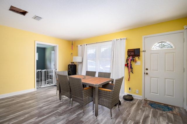 dining area with hardwood / wood-style flooring