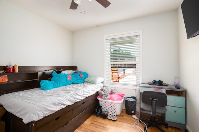 bedroom featuring hardwood / wood-style flooring and ceiling fan