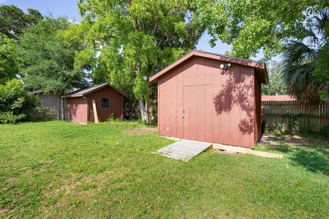 view of outbuilding with a lawn