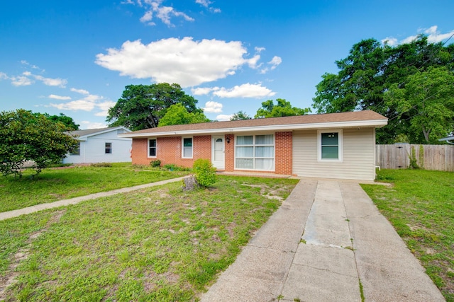 ranch-style house featuring a front lawn