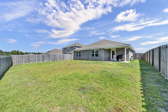 view of yard featuring a fenced backyard and a patio