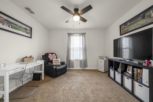 sitting room featuring a ceiling fan, baseboards, visible vents, and carpet flooring