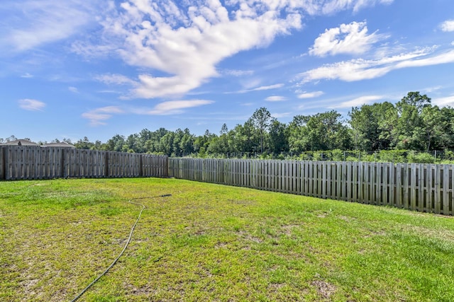 view of yard featuring a fenced backyard