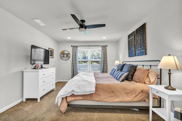 bedroom with baseboards, ceiling fan, and light colored carpet