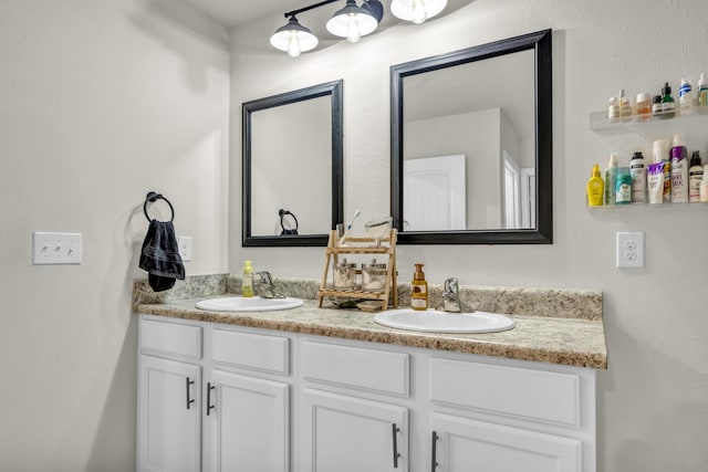 full bath featuring a sink and double vanity