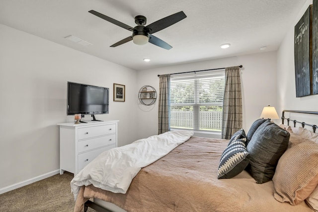 carpeted bedroom featuring a ceiling fan, recessed lighting, visible vents, and baseboards