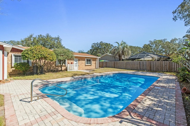 view of pool with a fenced in pool, a patio area, and a fenced backyard