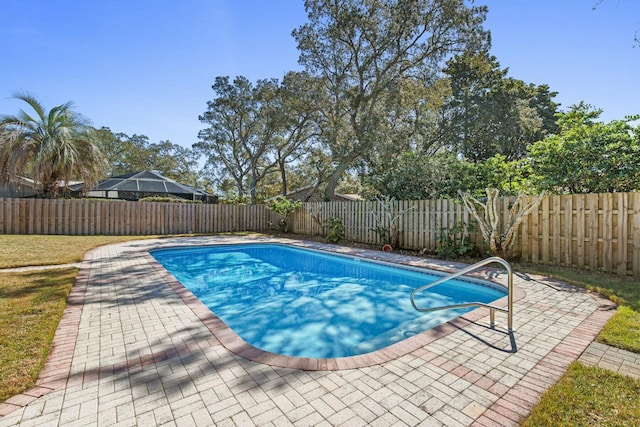 view of swimming pool with a patio area, a fenced backyard, and a fenced in pool