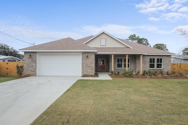 view of front facade featuring a garage and a front yard