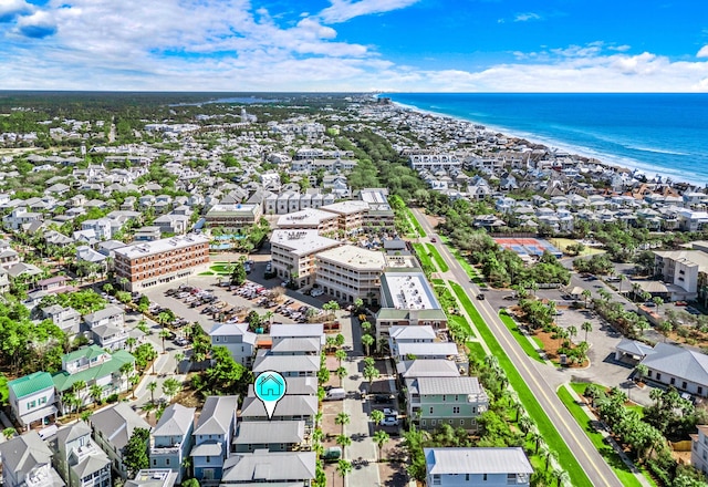 birds eye view of property featuring a water view and a view of the beach