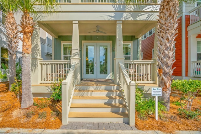 view of exterior entry with a porch and french doors