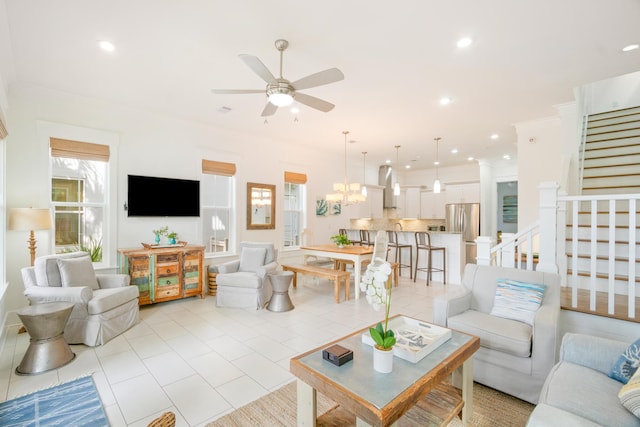 living room featuring recessed lighting, light tile patterned flooring, stairway, and ceiling fan with notable chandelier