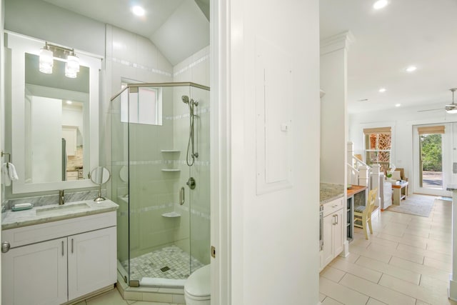 bathroom with a stall shower, vanity, and recessed lighting