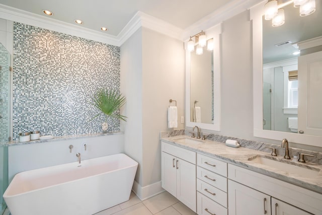 full bath featuring tile patterned flooring, crown molding, visible vents, and a sink