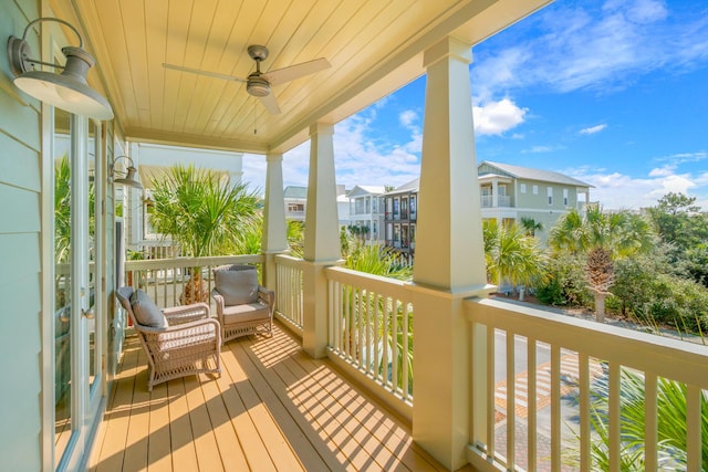 balcony with ceiling fan and a residential view