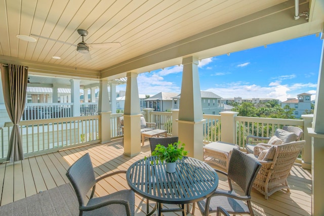 wooden terrace featuring ceiling fan