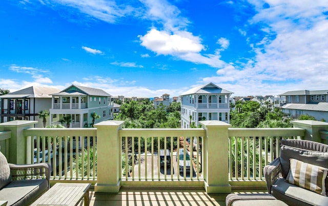 wooden terrace featuring a residential view