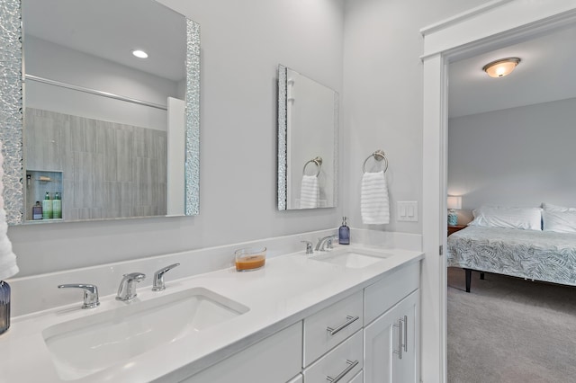 ensuite bathroom featuring a sink, ensuite bathroom, and double vanity