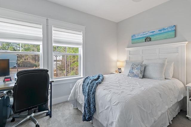 bedroom with carpet and baseboards