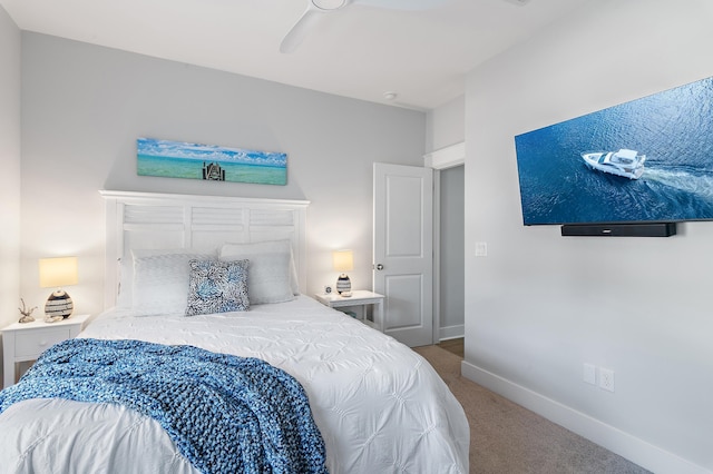 bedroom with carpet floors, a ceiling fan, and baseboards