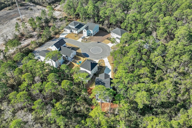 birds eye view of property with a residential view and a view of trees