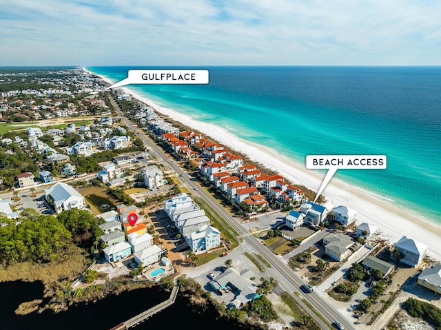 aerial view featuring a view of the beach and a water view