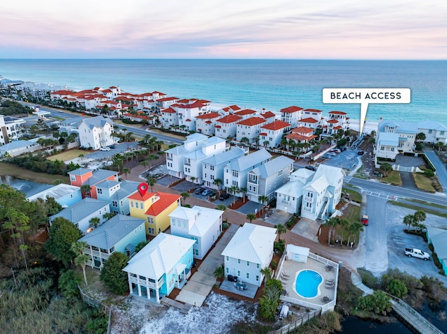 bird's eye view featuring a water view and a residential view