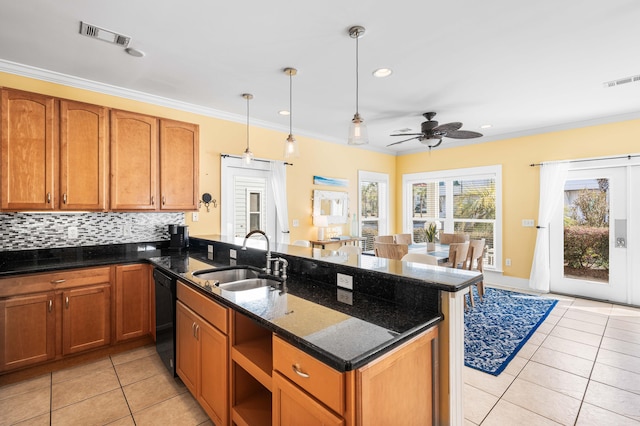 kitchen featuring visible vents, ornamental molding, a sink, dishwasher, and a peninsula