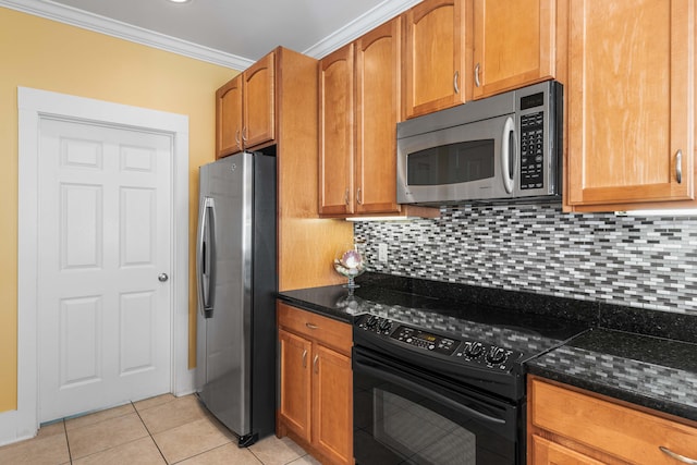 kitchen featuring light tile patterned floors, stainless steel appliances, decorative backsplash, dark stone countertops, and crown molding