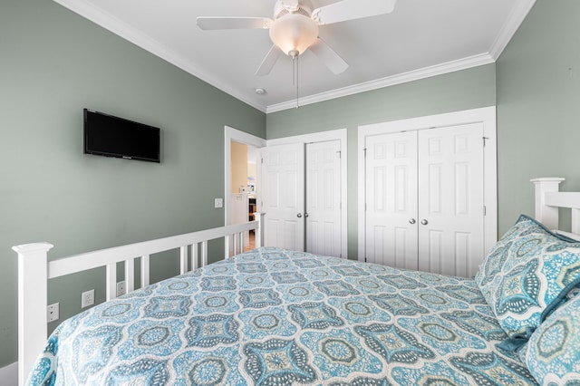 bedroom featuring ceiling fan, ornamental molding, and multiple closets