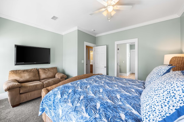 bedroom with baseboards, visible vents, a ceiling fan, light colored carpet, and crown molding