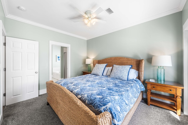 carpeted bedroom featuring ceiling fan, ensuite bathroom, visible vents, and crown molding