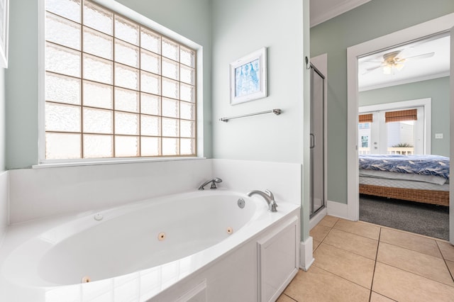 full bathroom featuring ornamental molding, tile patterned flooring, and a healthy amount of sunlight