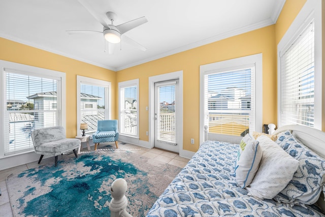 tiled bedroom with crown molding, ceiling fan, baseboards, and access to exterior