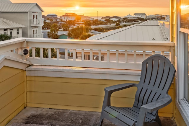 balcony at dusk with a residential view