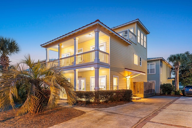 view of front of home featuring a balcony and metal roof