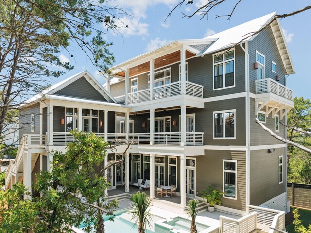 215 Buddy St, Santa Rosa Beach, FL 32459 - back of house with a balcony, a patio, and an outdoor pool