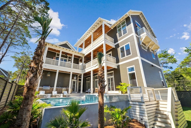 215 Buddy St, Santa Rosa Beach, FL 32459 - back of property with a balcony, an outdoor pool, and a patio area