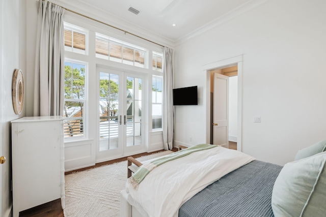 215 Buddy St, Santa Rosa Beach, FL 32459 - bedroom featuring french doors, access to exterior, crown molding, wood finished floors, and baseboards
