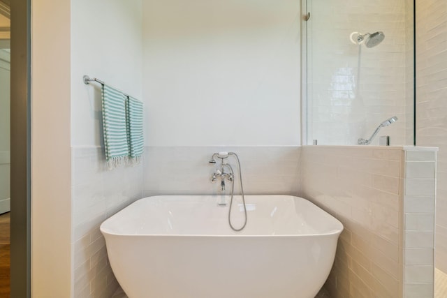 215 Buddy St, Santa Rosa Beach, FL 32459 - full bathroom featuring walk in shower, a soaking tub, and tile walls
