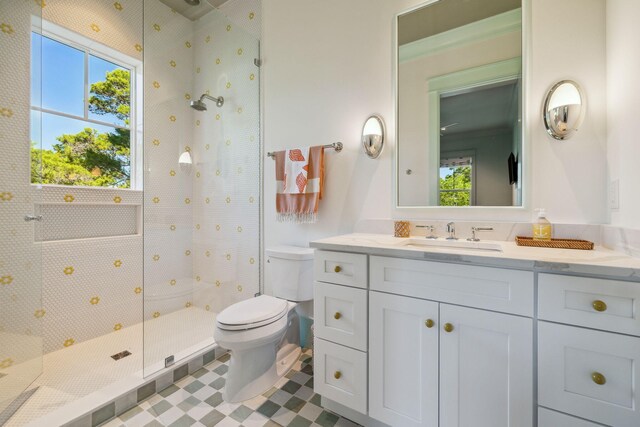 215 Buddy St, Santa Rosa Beach, FL 32459 - bathroom with tiled shower, toilet, healthy amount of natural light, and vanity